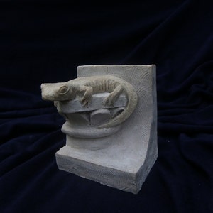 The salamander, reconstituted stone figurine.