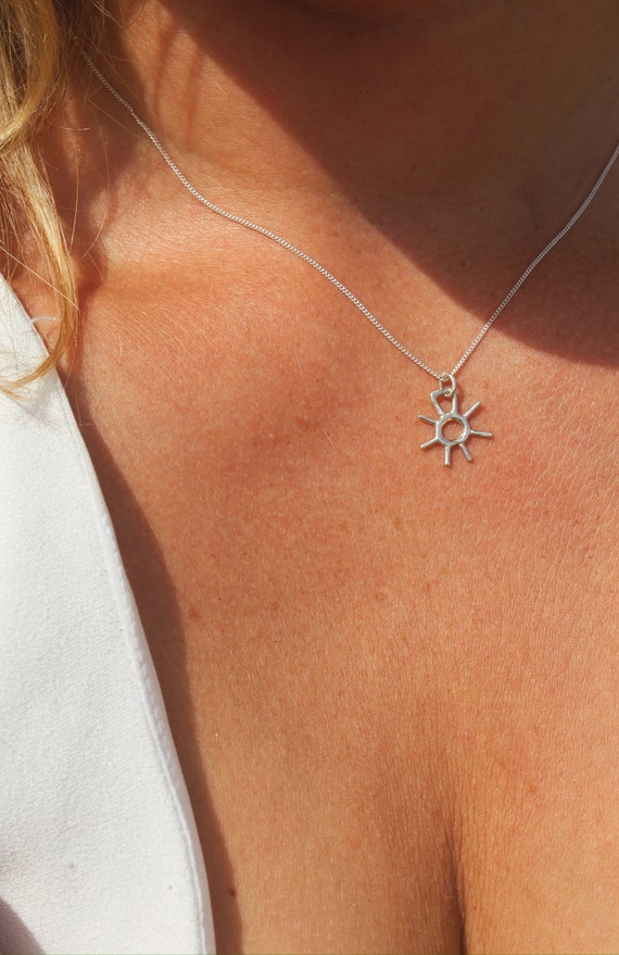 Shining Sun pendant with silver embroidery