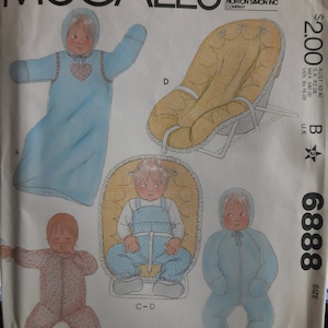 May include: Sewing pattern for a baby's outfit, including a hooded sleeper, a jumpsuit, and a hooded jacket. The pattern is from McCall's and is size newborn. The pattern is illustrated with drawings of babies wearing the outfits.