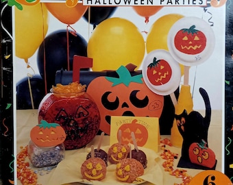 May include: A magazine cover titled "Craft-A-Party Halloween Parties" with various Halloween decorations. The cover features balloons, pumpkin-shaped crafts, and candy apples. Text includes "Over 35 Projects!" and "6 Big Party Ideas!"