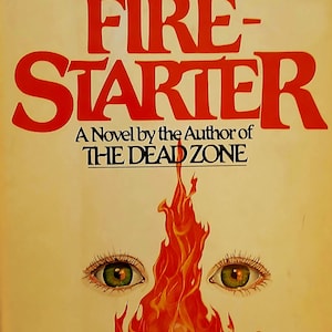 May include: A book cover with a cream background featuring the title FIRESTARTER in large red letters. Above the title is the author name STEPHEN KING in black. Below the title is the text A Novel by the Author of THE DEAD ZONE.