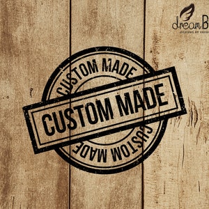 May include: Black and white custom made stamp on a wood background. The stamp is a circle with the words "Custom Made" inside. The words "Custom Made" are also written on a rectangle that is overlapping the circle.