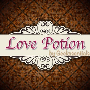 May include: A decorative label with a brown and black patterned background. The label features a white ornate frame with the text "Love Potion by Geekssentials" in pink and white.