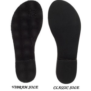 May include: Two black shoe soles are displayed side-by-side against a white background. The left sole is labeled "VIBRAM SOLE" and has a textured, grid-like pattern. The right sole, labeled "CLASSIC SOLE", has a smooth, slightly textured surface.