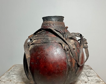 Leather banded water Gourd with Drinking. Maasai culture, Kenya.
