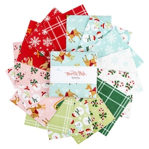 May include: A collection of Christmas-themed fabric squares in various colors and patterns. Designs include reindeer, snowmen, snowflakes, and candy canes. The fabric bundle is labeled "The North Pole" and is arranged in a circular shape.