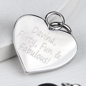 Rhodium plated heart shaped disc charm which can be engraved on one or both sides shown close up.