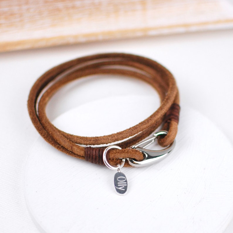 Personalised Men's suede double wrap bracelet shown in brown suede with engraved disc shown close up.