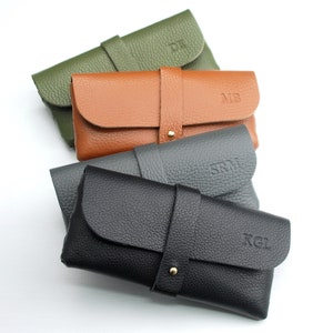 Personalised Men's Leather Glasses case showing debossed initials on black, grey, tan and khaki colour options.