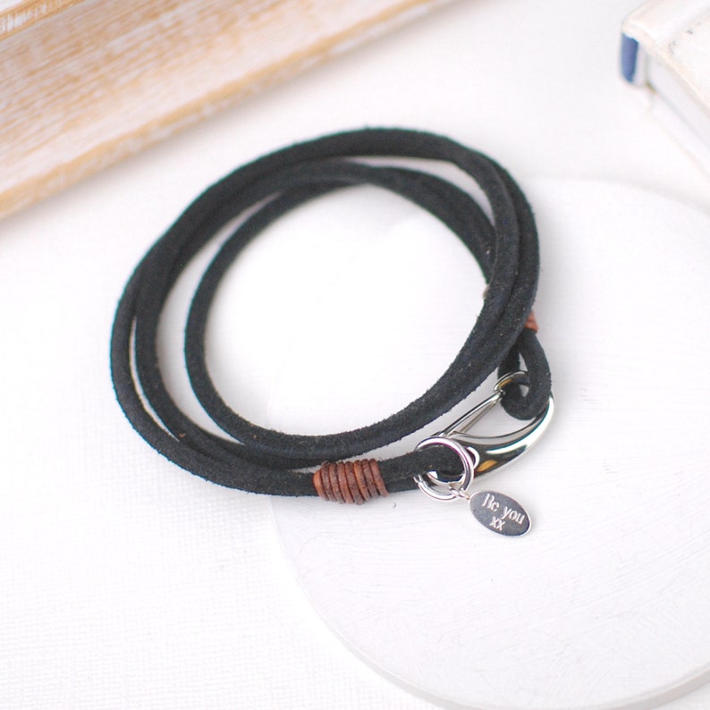 Personalised Men's suede double wrap bracelet shown in black suede with engraved disc shown close up.