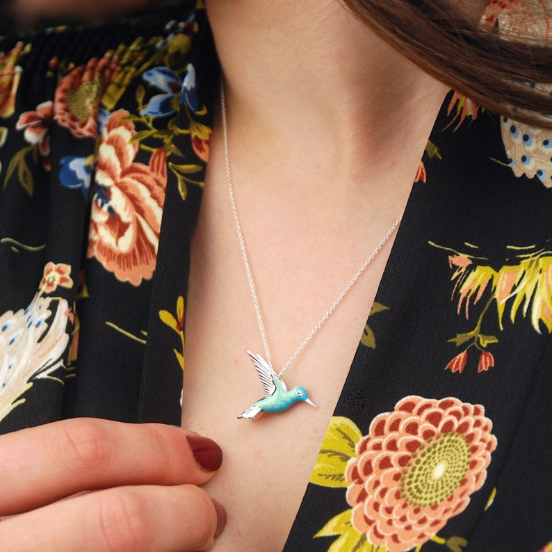 Sterling Silver and Enamel Hummingbird Necklace shown in close up on model