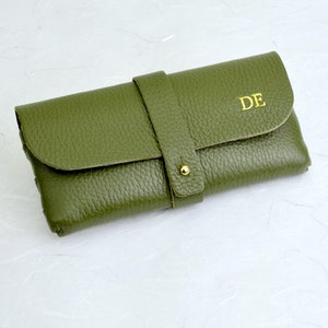 Personalised Men's  Leather Glasses Case in khaki with monogram DE initials with gold foil shown close up.