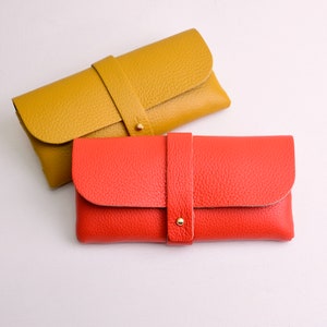 Monogram Leather Glasses Case shown in orange and mustard