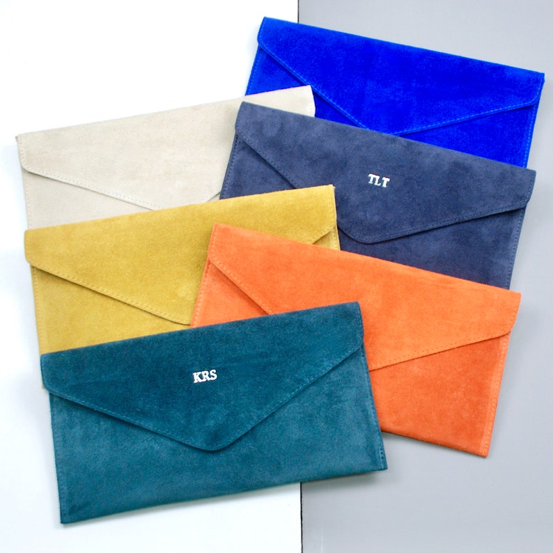Monogrammed Suede Envelope Clutch - Colour options: from top right: Cobalt, Stone/Nude, Navy blue, Mustard, Orange and Teal
