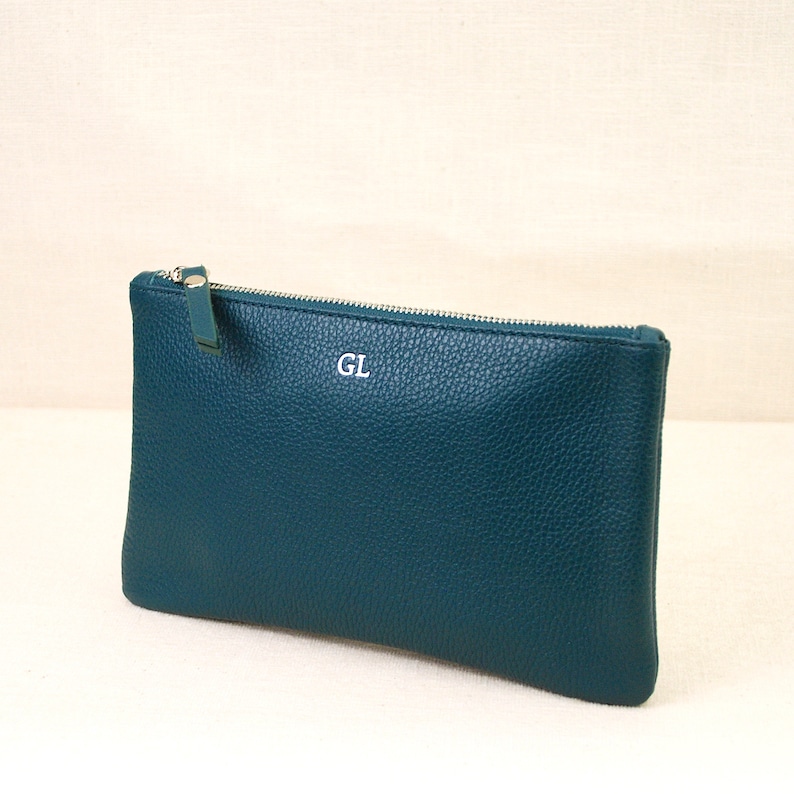 Monogram Leather Cosmetic Bag in teal showing GL initials in silver close up.
