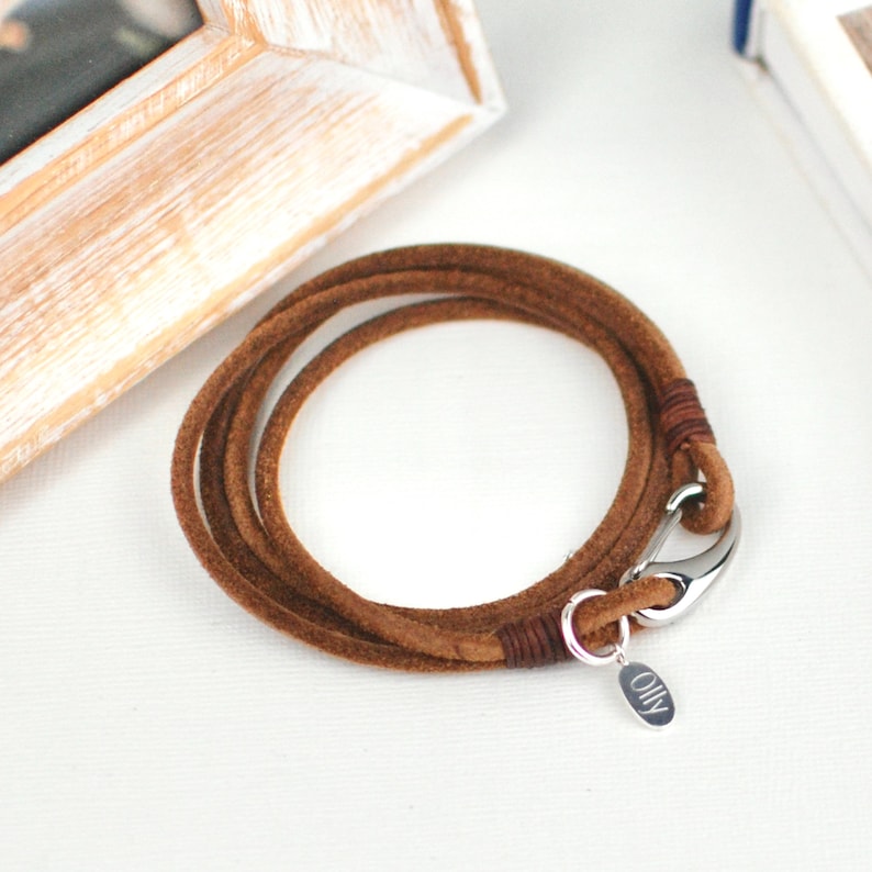 Personalised Men's suede double wrap bracelet shown in brown suede with engraved disc shown close up.