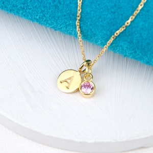 Personalised Gold Initial Birthstone necklace on 18" chain shown close up. Letter A charm and Alexandrite/June birthstone.