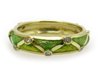 May include: A gold band ring with green enamel and small diamonds set in the band.