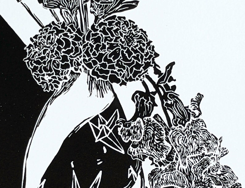 Detail of bold black and white original linoleum block print of floral still life bouquet in a patterned vase.