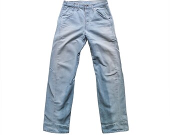 May include: Light blue denim jeans with a straight leg and a button fly.