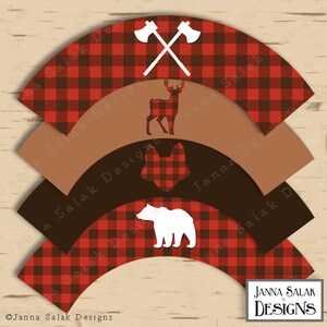 May include: Set of four red and black buffalo plaid cupcake wrappers with white silhouette images of a deer, fox, bear, and crossed axes. The wrappers are designed for a woodland themed party.