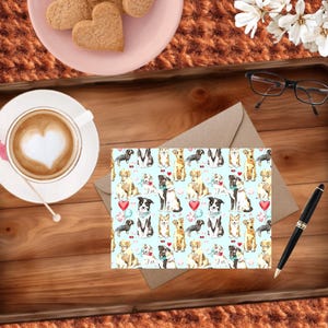 May include: A wooden tray holds a cup of coffee with heart-shaped foam, heart-shaped cookies, and a greeting card with a dog pattern. A pen and glasses are also on the tray. The card features various dog breeds with hearts and balloons.