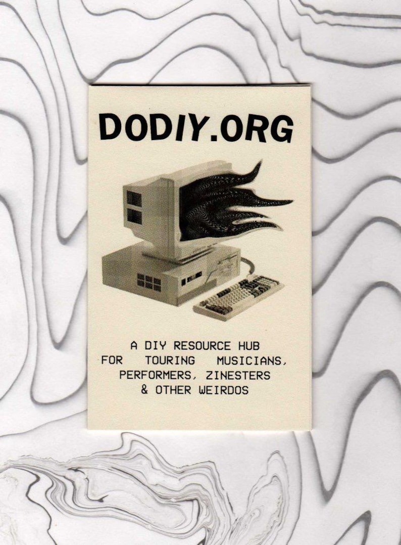 May include: A rectangular off-white zine cover featuring the black text DODIY.ORG at the top. Below is a black and white illustration of a vintage computer monitor with tentacles emerging from the screen, next to a keyboard. The text at the bottom reads: A DIY RESOURCE HUB FOR TOURING MUSICIANS, PERFORMERS, ZINESTERS & OTHER WEIRDOS.