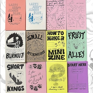 May include: A collection of twelve rectangular paper zines arranged in a grid, featuring various hand-drawn illustrations and text in black ink on colorful paper backgrounds including pink, cream, tan, yellow, green, and purple covers.