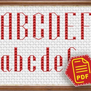 Puede incluir: Patrón de punto de cruz para el alfabeto en un esquema de color rojo y blanco. El patrón incluye letras mayúsculas y minúsculas. Un icono de PDF está en la esquina inferior derecha de la imagen.