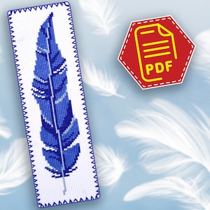 May include: A blue and white cross stitch bookmark featuring a single blue feather with white accents. The bookmark has a white background and a white scalloped border.