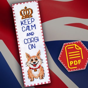 May include: A white cross-stitch bookmark with a red border. The bookmark features a cartoon corgi dog and the text "Keep Calm and Corgi On". A crown is above the text. The bookmark is on a red, white, and blue background.