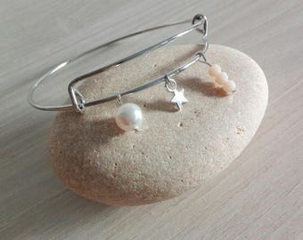 Bangle is silver with beads and small star