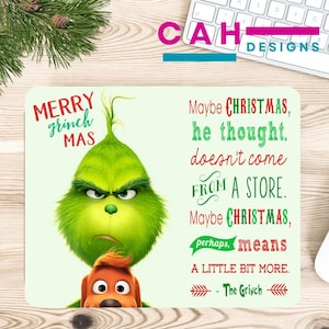 May include: A rectangular mousepad featuring the Grinch and Max from the movie "How the Grinch Stole Christmas." The mousepad has the text "Merry Grinch Mas" and a quote about Christmas. The Grinch is green, and Max is brown.