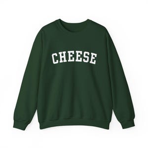 May include: A dark green sweatshirt with the word "CHEESE" printed in white on the front.