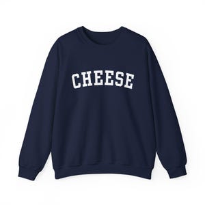 May include: A navy blue sweatshirt with the word "CHEESE" printed in white on the front.