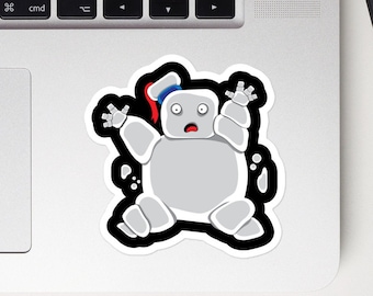 May include: A cartoon illustration of a white marshmallow ghost with a red and blue hat, with a surprised expression, on a black background.