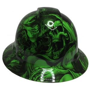 May include: Green hard hat with a skull and flames graphic design.