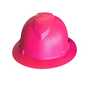 Könnte beinhalten: Ein leuchtend pinkfarbener Helm mit strukturierter Oberfläche. Der Helm hat einen erhöhten Rand und eine spitze Krone.