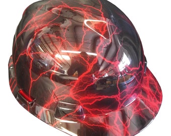May include: A black hard hat with a red lightning bolt pattern. The hard hat has a brim.