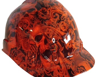 May include: Orange hard hat with a skull and roses graphic design.