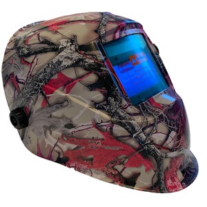 May include: A camouflage welding helmet with a digital display that reads "Warning! Please check the protection level before use."
