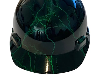 May include: A black hard hat with a green lightning bolt pattern.