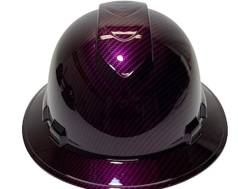 May include: A purple hard hat with a carbon fiber pattern. The hat has a wide brim and a black strap.
