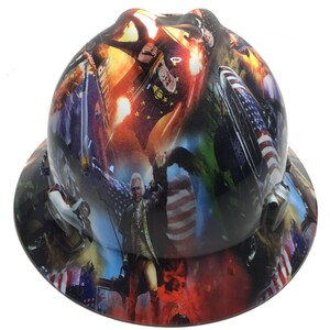 May include: A hard hat with a patriotic design featuring images of American flags, historical figures, and explosions. The hat has a wide brim and a glossy finish, with a color palette of red, white, blue, and gold.