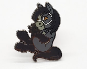 May include: A black and grey enamel pin of a cartoon horse wearing a face mask. The horse has a long black mane and tail, and its eyes are orange.