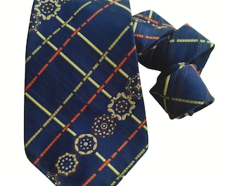 May include: A blue patterned tie with orange and yellow stripes and brown and white floral designs.