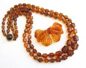 Amber Barrel Beaded Double Row Vintage 28 quot Long Necklace and Plastic Amber Large Floral Bow 3 1 8 quot Wide Brooch - Estate Jewelry