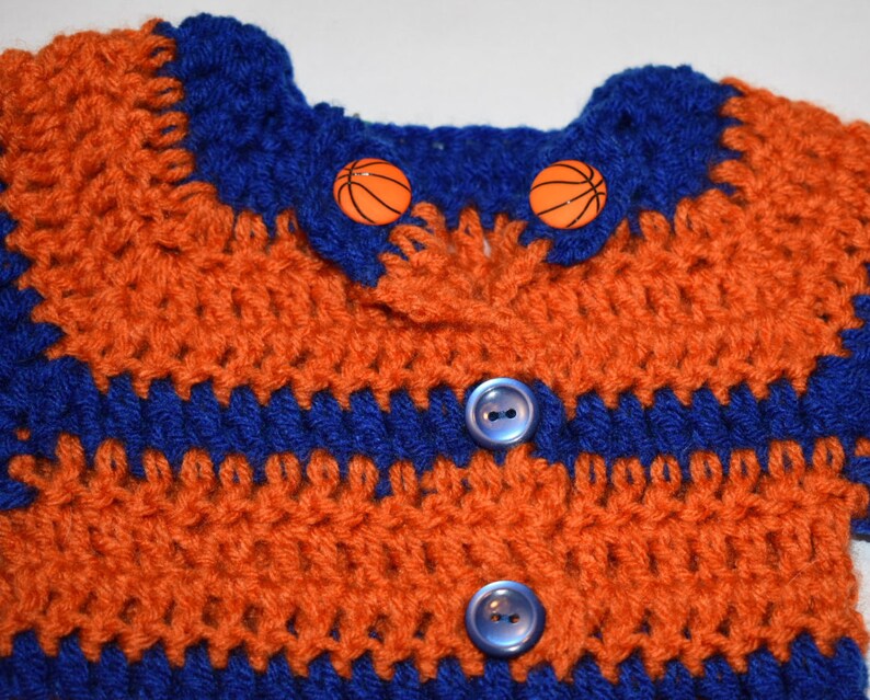 Newborn to 3m Orange and Blue crochet long-sleeve sweater; wbasketball accent buttons