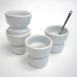 Four ergonomic espresso cups, pottery, stoneware in white glossy glaze