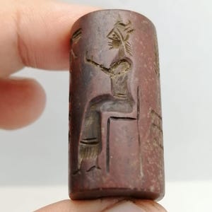 Ancient Cylinder Seal | Red Stone Carved Ritual Scene with Plants & Seated Deity